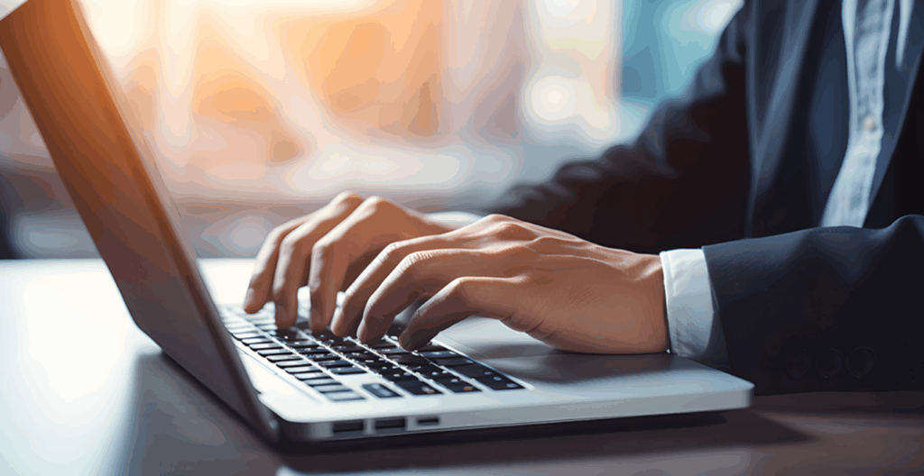 Supply chain business owner reviews his accounts receivable and payable using a laptop computer.