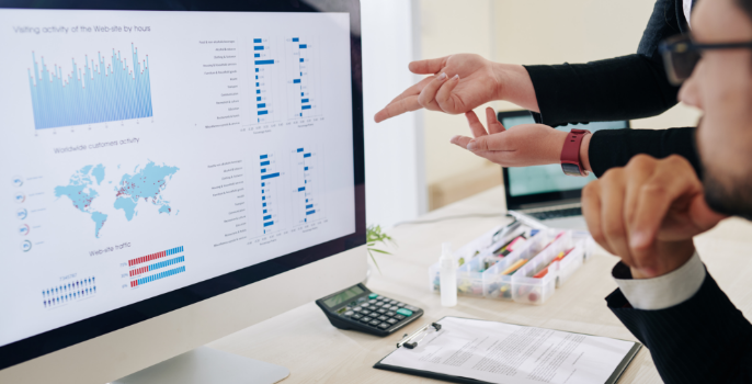 Close-up shot of a logistics professional working on a computer, combining and consolidating data from various sources across the entire supply chain to gain a unified and comprehensive view of operations.